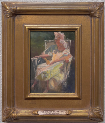 Two Girls in Wicker Chair